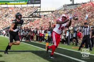 Nebraska Cornhusker running back Rahmir Johnson (14) reaches for the ball against Purdue Boilermaker defensive end Will Heldt (15) during a college football game Saturday, September 28, 2024, in West Lafayette, Indiana. Photo by John S. Peterson.