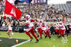 Nebraska Cornhusker quarterback Dylan Raiola (15) leads the Huskers on the filed to take on the Purdue Boilermakers during a college football game Saturday, September 28, 2024, in West Lafayette, Indiana. Photo by John S. Peterson.