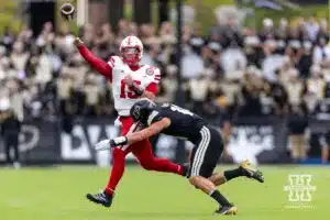 Nebraska Cornhusker quarterback Dylan Raiola (15) throws a pass against Purdue Boilermaker linebacker Yanni Karlaftis (14) during a college football game Saturday, September 28, 2024, in West Lafayette, Indiana. Photo by John S. Peterson.