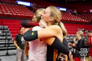 USC Trojan outside hitter Ally Batenhorst (14) gives Nebraska Cornhusker Andi Jackson (15) a hug after the volleyball match Sunday, September 29, 2024, in Lincoln, Nebraska. Photo by John S. Peterson.