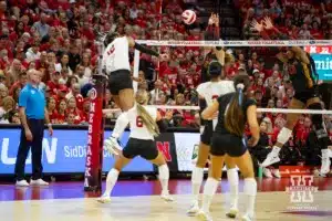 Nebraska Cornhusker Taylor Landfair (12) spikes the ball down the line against USC Trojan opposite Madison Pietsch (23) during a college volleyball match Sunday, September 29, 2024, in Lincoln, Nebraska. Photo by John S. Peterson.