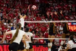 Nebraska Cornhusker Merritt Beason (13) scores match point against USC Trojan opposite Adonia Faumuina (1) and Madison Pietsch in the third set during a college volleyball match Sunday, September 29, 2024, in Lincoln, Nebraska. Photo by John S. Peterson.
