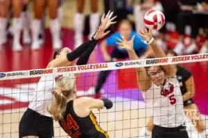Nebraska Cornhuskers Merritt Beason (13) and Rebekah Allick jump to try and block USC Trojan outside hitter Ally Batenhorst (14) during a college volleyball match Sunday, September 29, 2024, in Lincoln, Nebraska. Photo by John S. Peterson.