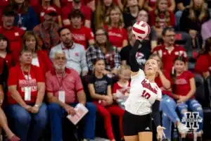 Nebraska Cornhusker Olivia Mauch (10) serves the ball against the USC Trojans during a college volleyball match Sunday, September 29, 2024, in Lincoln, Nebraska. Photo by John S. Peterson.