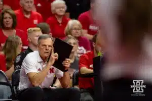 Nebraska Cornhusker head coach John Cook gives a signal for the serve against the USC Trojans during a college volleyball match Sunday, September 29, 2024, in Lincoln, Nebraska. Photo by John S. Peterson.