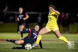 Nebraska Cornhusker midfielder Haley Peterson (2) attacks the ball against Oregon Duck midfielder Alice Barbieri (23) in the first half during a soccer match Thursday, October 17, 2024, in Lincoln, Nebraska. Photo by John S. Peterson.