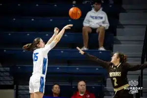 Creighton Bluejay guard Lauren Jensen (15) makes a three point shot from the corner against Southwest Minnesota State Mustang guard Bri Stoltzman (2) in the first half during a college women’s basketball game Thursday, October 30, 2024, in Lincoln, Nebraska. Photo by John S. Peterson.