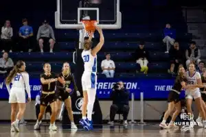 Creighton Bluejay guard/forward Morgan Maly (30) makes a three point shot from the top of the arch against the Southwest Minnesota State Mustangs in the first half during a college women’s basketball game Thursday, October 30, 2024, in Lincoln, Nebraska. Photo by John S. Peterson.