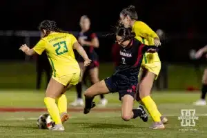 Nebraska Cornhusker midfielder Haley Peterson (2) attacks the ball against Oregon Duck midfielder Alice Barbieri (23) in the first half during a soccer match Thursday, October 17, 2024, in Lincoln, Nebraska. Photo by John S. Peterson.