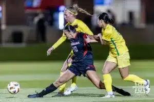 Nebraska Cornhusker midfielder Florence Belzile (10) battles for the ball against the Oregon Ducks in the first half during a soccer match Thursday, October 17, 2024, in Lincoln, Nebraska. Photo by John S. Peterson.