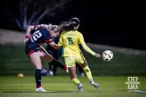 Nebraska Cornhusker forward Sarah Weber (42) takes a shot against Oregon Duck midfielder Grace Mensah (6) in the first half during a soccer match Thursday, October 17, 2024, in Lincoln, Nebraska. Photo by John S. Peterson.