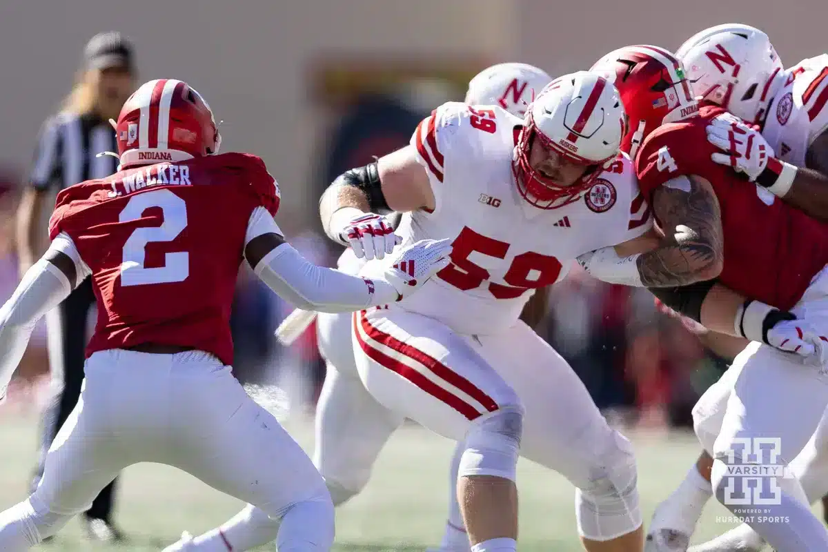 Nebraska Football v Indiana – October 19, 2024. Nebraska Cornhusker offensive lineman Henry Lutovsky (59) blocking Indiana Hoosier linebacker Jailin Walker (2) and Aiden Fisher during a football game Saturday, October 19, 2024, in Bloomington, Indiana. Photo by John S. Peterson.