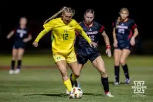 Nebraska Cornhusker forward Sarah Weber (42) guards against Oregon Duck forward Callan Harrington (12) in the second half during a soccer match Thursday, October 17, 2024, in Lincoln, Nebraska. Photo by John S. Peterson.