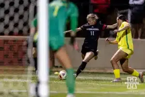 Nebraska Cornhusker midfielder Sadie Waite (11) kicks the ball against the Oregon Ducks during a soccer match Thursday, October 17, 2024, in Lincoln, Nebraska. Photo by John S. Peterson.