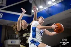 Creighton Bluejay guard Lauren Jensen (15) makes lay up against Southwest Minnesota State Mustang guard Peyton Blandin (21) in the second half during a college women’s basketball game Thursday, October 30, 2024, in Lincoln, Nebraska. Photo by John S. Peterson.