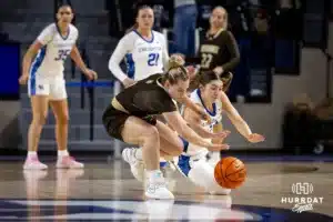 Creighton Bluejay guard Allison Heathcock (13) and Southwest Minnesota State Mustang guard Zoie Centers (3) dive for the basketball in the second half during a college women’s basketball game Thursday, October 30, 2024, in Lincoln, Nebraska. Photo by John S. Peterson.