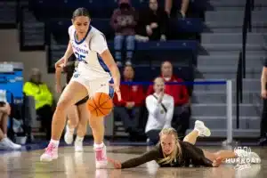 Creighton Bluejay center Elizabeth Gentry (35) dribbles away from Southwest Minnesota State Mustang forward Audrey Swanson (22) after falling short diving for the ball in the second half during a college women’s basketball game Thursday, October 30, 2024, in Lincoln, Nebraska. Photo by John S. Peterson.