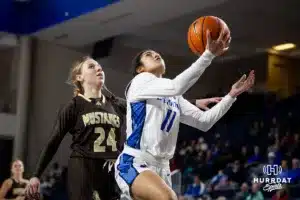 Creighton Bluejay guard Kiani Lockett (11) makes a lay up against Southwest Minnesota State Mustang guard Kadence Hesse (24) in the second half during a college women’s basketball game Thursday, October 30, 2024, in Lincoln, Nebraska. Photo by John S. Peterson.