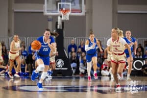 Creighton Bluejay guard Lauren Jensen (15) steals the ball for a fast break against Nebraska Cornhusker guard Alberte Rimdal (5) during a women’s college basketball game Friday, November 22, 2024 in Omaha, Nebraska. Photo by John S. Peterson.