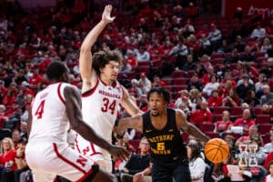 Nebraska Cornhusker center Braxton Meah (34) and forward Juwan Gary (4) guard against Bethune-Cookman Wildcat guard Gianni Hunt (5) in the first half during a college baskteball game Saturday, November 9, 2024, in Lincoln, Nebraska. Photo by John S. Peterson.