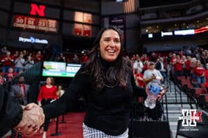 Nebraska Cornhusker head coach Amy Williams shakes a fan's hand as she walks out to the court to take on the Southern Lady Jaguars during a college basketball game Tuesday, November 12, 2024, in Lincoln, Nebraska. Photo by John S. Peterson.