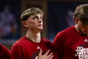 Nebraska Cornhusker guard Connor Essegian (0) looks to the flag during the National Anthem before a college basketball game against the St. Mary's Gaels Sunday, November 17, 2024 in Sioux Falls, South Dakota.