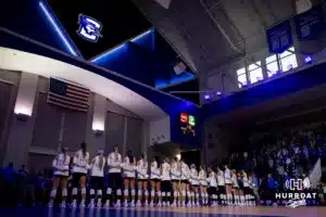 Creighton Bluejays standing on the court for the National Anthem before taking on the St. John's Red Storm during a college volleyball match Friday, November 1, 2024, in Omaha, Nebraska. Photo by John S. Peterson.