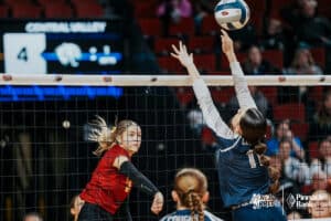 Leyton's Riley Jones (3) spikes the ball against Central Valley's Bentleigh Dugan (11 during the semi-finals of the 2024 NSAA Volleyball Championships Friday, November 8, 2024, in Lincoln, Nebraska. Photo by Mike Sautter.