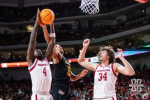 Nebraska Cornhusker forward Juwan Gary (4) grabs the rebound against Bethune-Cookman Wildcat forward Reggie Ward Jr. (15) in the first half during a college baskteball game Saturday, November 9, 2024, in Lincoln, Nebraska. Photo by John S. Peterson.