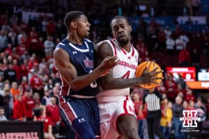 Nebraska Cornhusker forward Juwan Gary (4) drives into Fairleigh Dickinson Knight guard Ahmed Barba-Bey (8) to set up a jump shot in the first half during a college basketball game Wedday, November 13, 2024, in Lincoln, Nebraska. Photo by John S. Peterson.