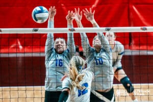 Shelton's Macy Willis (16) and Kaycee Tompkin (10) try to block Overton's Daisy Ryan (12) during the semi-finals of the 2024 NSAA Volleyball Championships Friday, November 8, 2024, in Lincoln, Nebraska. Photo by Mike Sautter.