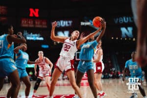 Nebraska Cornhusker Natalie Potts (22) grabs the ball against Southern Lady Jaguar guard Aniya Gourdine (1) during a college basketball game on Tuesday, November 12, 2024, in Lincoln, Nebraska. Photo by Charlotte A. Gottfried.