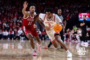 Nebraska Cornhuskers guard Brice Williams (3) drives to the basket agasinst South Dakota Coyotes guard Dre Bullock (11) in the first half during a college basketball game Wednesday, November 27, 2024, in Lincoln, Nebraska. Photo by John S. Peterson.