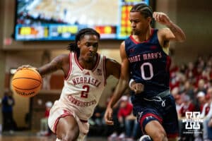 Nebraska Cornhusker guard Ahron Ulis (2) dribbles the ball against St. Mary's Gaels guard Mikey Lewis (0) during a college basketball game Sunday, November 17, 2024 in Sioux Falls, South Dakota.