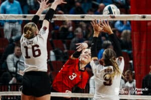 Superior's Jordan Duncan (3) spikes the ball against BDS's Kinzley Bohling (16) and Alexis Hergott (9) during the semi-finals of the 2024 NSAA Volleyball Championships Friday, November 8, 2024, in Lincoln, Nebraska. Photo by Mike Sautter.