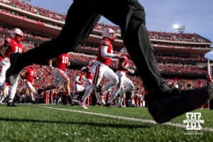 Nebraska Cornhusker quarterback Dylan Raiola (15) leads the Huskers out of the tunnel walk to take on the Wisconsin Badgers during a college football game Saturday, November 23, 2024 in Lincoln, Nebraska. Photo by John S. Peterson.