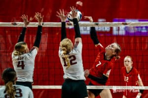 Superior's Halle Bargen (7) spikes the ball against BDS's Kaitlynn Nelson (4) and Olivia Schlegel (12) during the semi-finals of the 2024 NSAA Volleyball Championships Friday, November 8, 2024, in Lincoln, Nebraska. Photo by Mike Sautter.