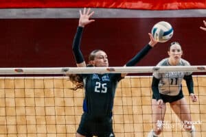 Minden's's Makenna Starkey (25) tries to block Kearney Catholic during the semi-finals of the 2024 NSAA Volleyball Championships Friday, November 8, 2024, in Lincoln, Nebraska. Photo by Mike Sautter.