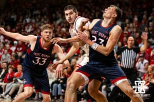 Nebraska Cornhusker forward Berke Buyuktuncel (9) fight for position against St. Mary's Gaels forward Paulius Murauskas (23) during a college basketball game Sunday, November 17, 2024 in Sioux Falls, South Dakota.