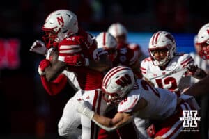 Nebraska Cornhusker running back Emmett Johnson (21) runs with the ball against the Wisconsin Badgers in the first quarter during a college football game Saturday, November 23, 2024 in Lincoln, Nebraska. Photo by John S. Peterson.