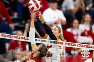 Nebraska Cornhusker middle blocker Andi Jackson (15) battles at the net against Wisconsin Badger setter Charlie Fuerbringer (24) in the first set during a college volleyball match Saturday, November 23, 2024 in Lincoln, Nebraska. Photo by John S. Peterson.