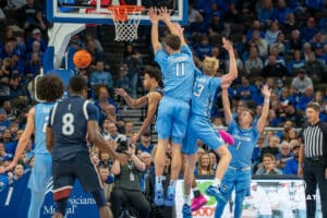 Ryan Kalkbrenner and Jackson McAndrew contest a shot during a college basketball game November 10th, 2024 in Omaha Nebraska. Photo by Brandon Tiedemann.