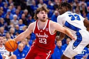 Nebraska Cornhusker forward Andrew Morgan (23) drives to the basket against Creighton Bluejay center Fredrick King (33) in the first half during a college basketball game Friday, November 22, 2024 in Omaha, Nebraska. Photo by John S. Peterson.