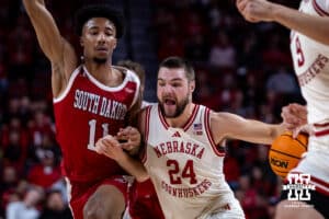 Nebraska Cornhuskers guard Rollie Worster (24) drives to the basket against South Dakota Coyotes guard Dre Bullock (11) in ther first half during a college basketball game Wednesday, November 27, 2024, in Lincoln, Nebraska. Photo by John S. Peterson.