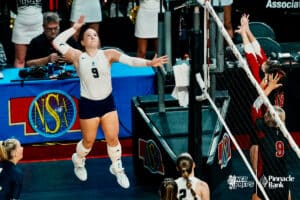 Lincoln Lutheran's Lily Wohlgemuth (9) sets up for a spike against Norfolk Catholic during the semi-finals of the 2024 NSAA Volleyball Championships Friday, November 8, 2024, in Lincoln, Nebraska. Photo by Mike Sautter.