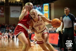 Nebraska Cornhusker guard Logan Nissley (2) drives the baseline against South Dakota Coyote guard Grace Larkins (21) during a college women's basketball game Saturday, November 16, 2024 in Sioux Falls, South Dakota. Photo by Collin Stilen.