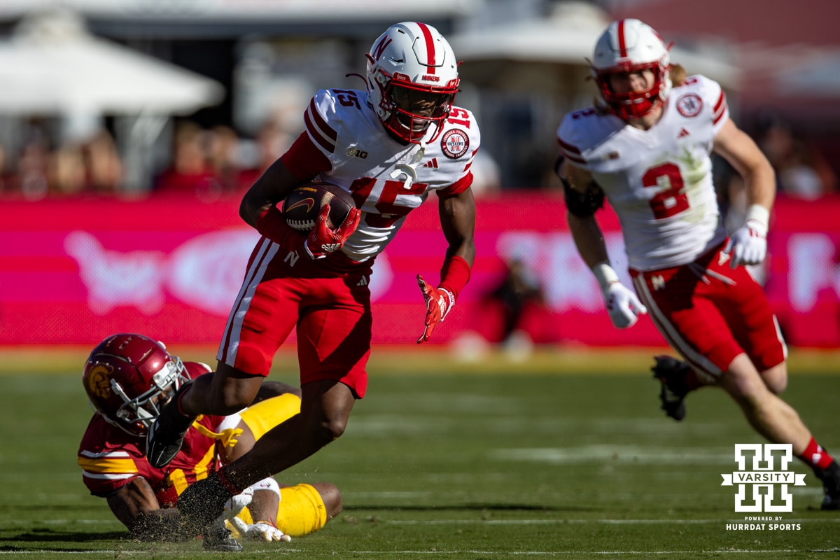 Nebraska Cornhusker defensive back Ceyair Wright (15) intercepts a pass against USC Trojan wide receiver Kyron Hudson (10) for a pick-six in the first quarter during a college football game Saturday, November 16, 2024 in Los Angeles, California. Photo by John S. Peterson.