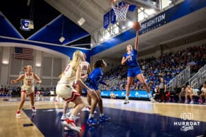 Creighton Bluejay forward Mallory Brake (14) makes a layup against the Nebraska Cornhuskers in the first half during a women’s college basketball game Friday, November 22, 2024 in Omaha, Nebraska. Photo by John S. Peterson.