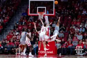 UT Rio Grande Valley Vaqueros guard Howie Fleming Jr. (5) tries to take a shot against Nebraska Cornhusker center Braxton Meah (34) and forward Berke Buyuktuncel (9) in the first half during a college baskteball game Monday, November 4, 2024, in Lincoln, Nebraska. Photo by John S. Peterson.