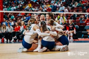 Lincoln Lutheran celebrabes their win over Norfolk Catholic during the semi-finals of the 2024 NSAA Volleyball Championships Friday, November 8, 2024, in Lincoln, Nebraska. Photo by Mike Sautter.